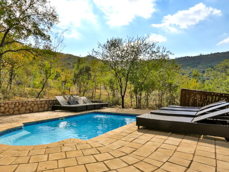Relaxing in a nature alongside a small plunge pool